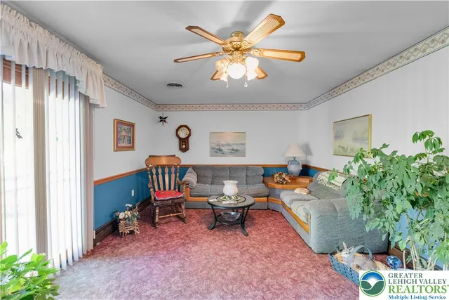 a bathroom with a granite countertop toilet sink and mirror