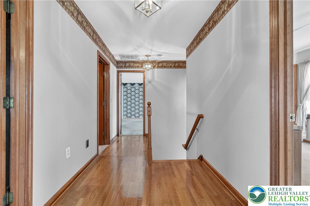 656 Daniels Road Nazareth, PA 18064 - Photo 26 of 54 a view of empty room with wooden floor and stairs