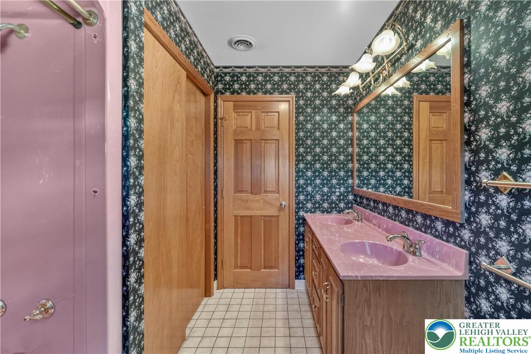 656 Daniels Road Nazareth, PA 18064 - Photo 28 of 54 a bathroom with a sink a mirror and shower