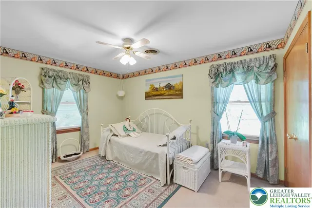 a view of staircase with furniture and a window