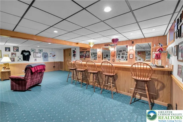 a bathroom with a sink a mirror and a shower