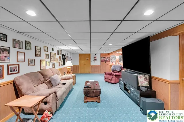 a view of a hallway with wooden shelves