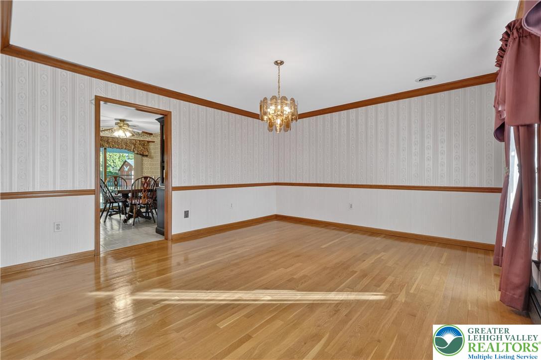 656 Daniels Road Nazareth, PA 18064 - Photo 7 of 54 a view of a livingroom with wooden floor and a chandelier