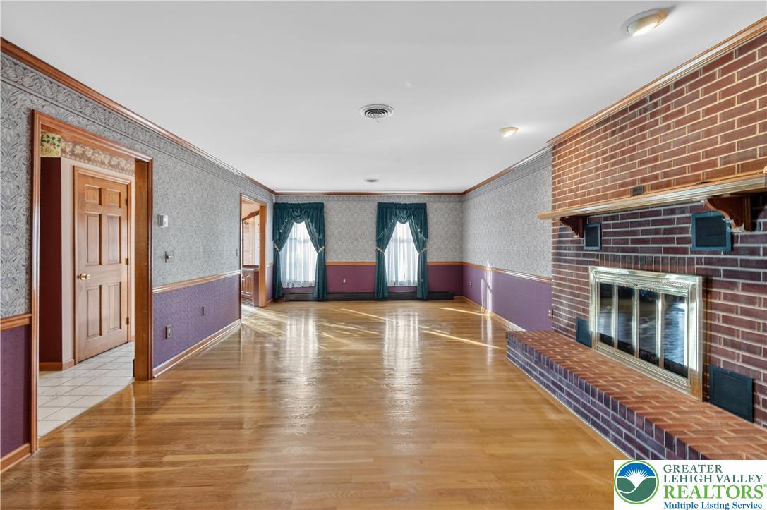 656 Daniels Road Nazareth, PA 18064 - Photo 10 of 54 a view of an empty room with wooden floor and a window