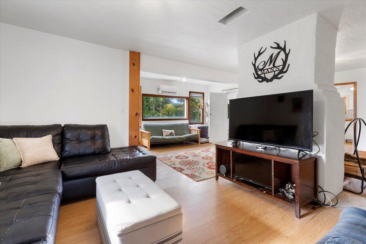 2938 North Fork Road Elliston, VA 24087 - Photo 8 of 41 a living room with furniture and a flat screen tv