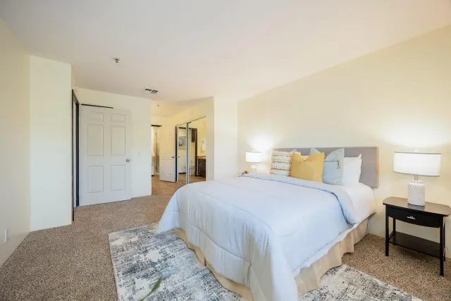 a bedroom with a bed and a couch