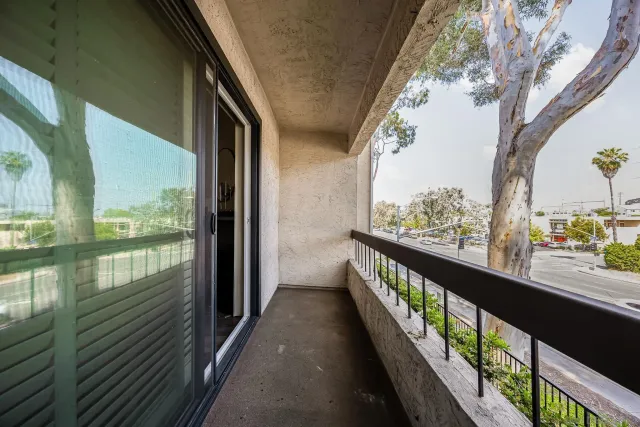 a view of balcony with wooden floor
