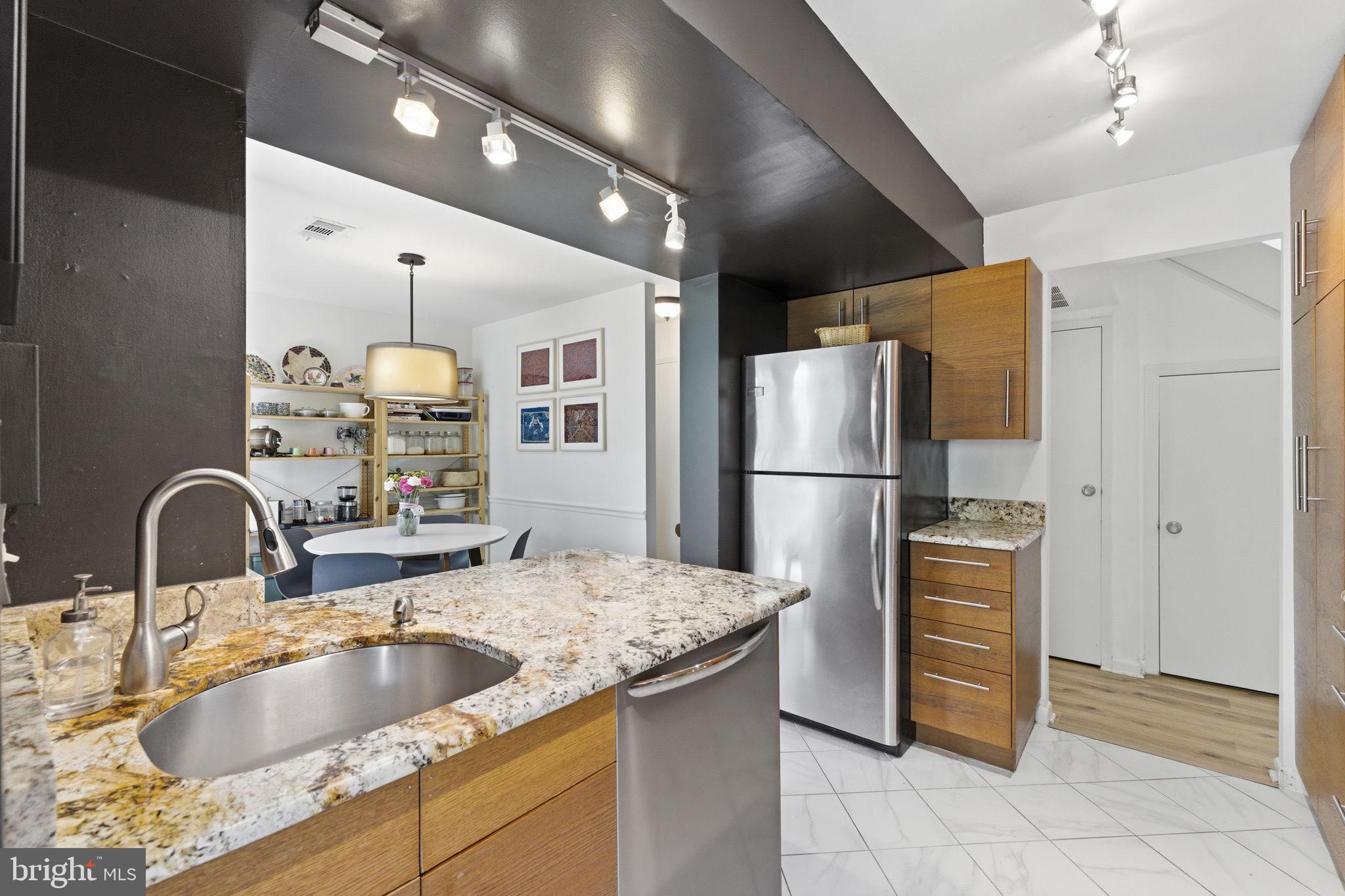 11260 Chestnut Grove Square, Unit 337 Reston, VA 20190 - Photo 19 of 82 Modern kitchen with sleek finishes.