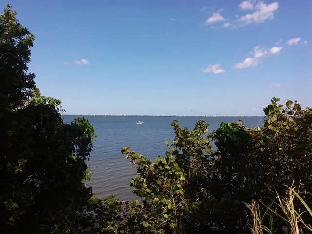a view of a lake with a building in front of it