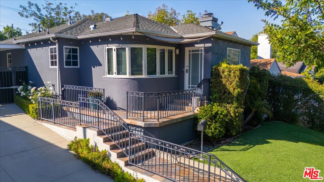 14041 Roblar Road Sherman Oaks, CA 91423 - Photo 41 of 47 a view of a house with brick walls and flower garden