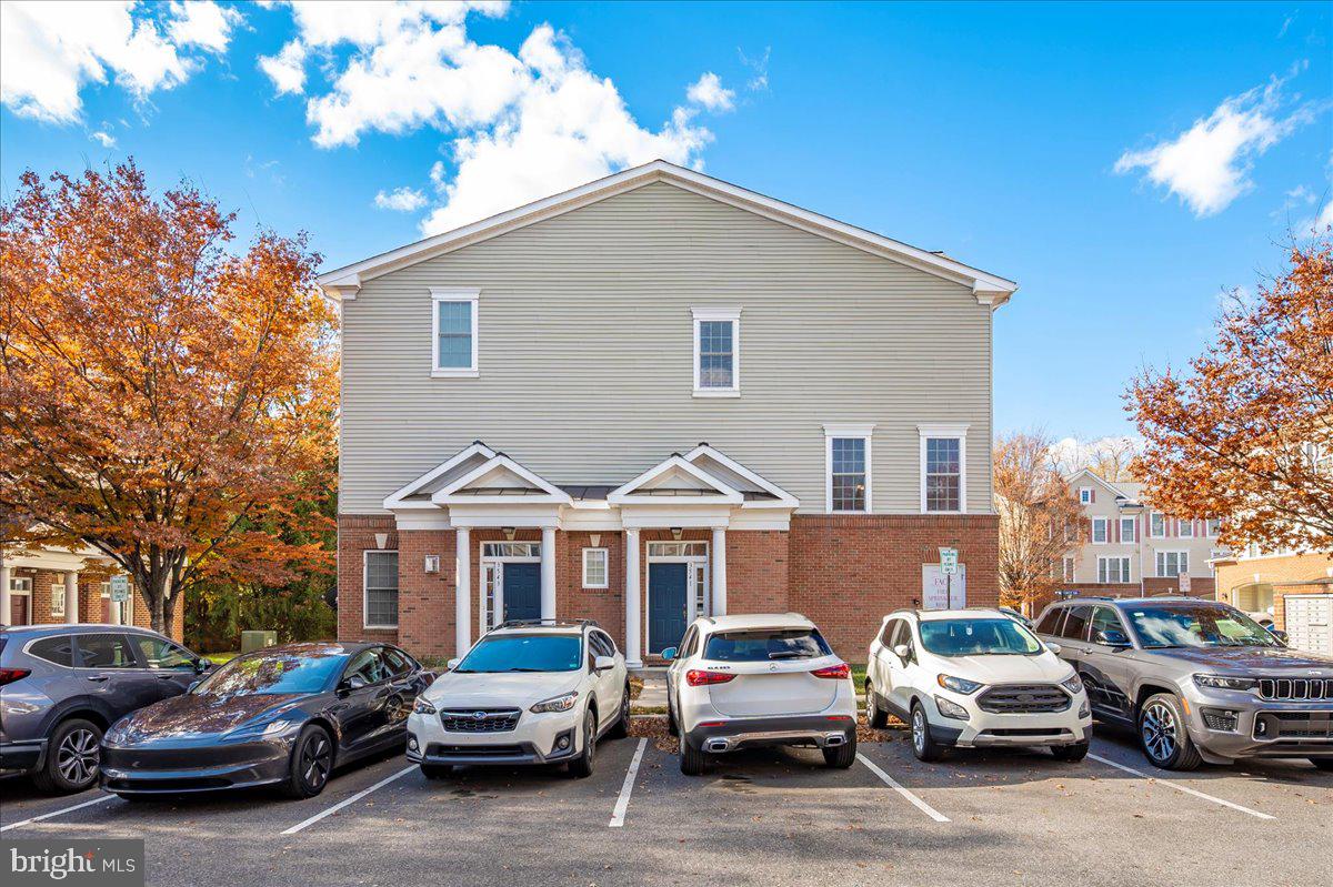 3541 Huntley Manor Lane, Unit 79B Alexandria, VA 22306 - Photo 39 of 40 a view of a car parked in front of a house