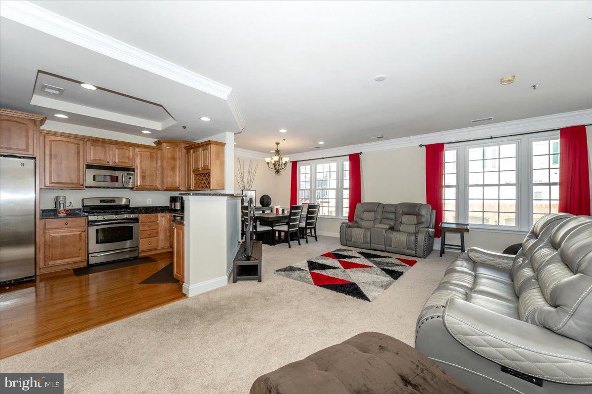 3541 Huntley Manor Lane, Unit 79B Alexandria, VA 22306 - Photo 4 of 40 a living room with furniture kitchen and a kitchen
