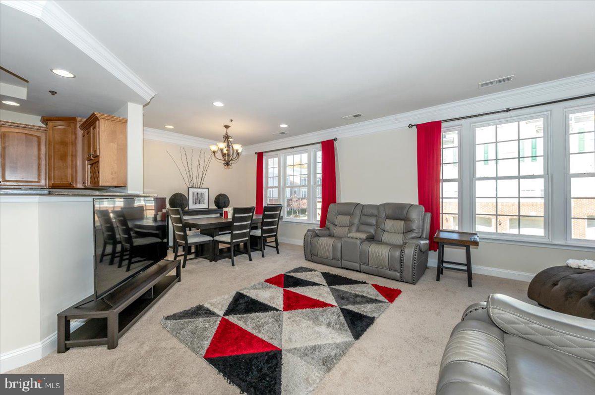 3541 Huntley Manor Lane, Unit 79B Alexandria, VA 22306 - Photo 7 of 40 a living room with furniture and a large window
