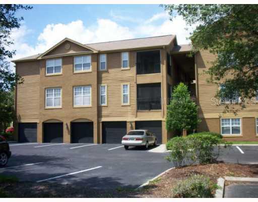 409 Summit Ridge Place, Unit 301 Longwood, FL 32779 - Photo 1 of 1 a front view of a house with parking space