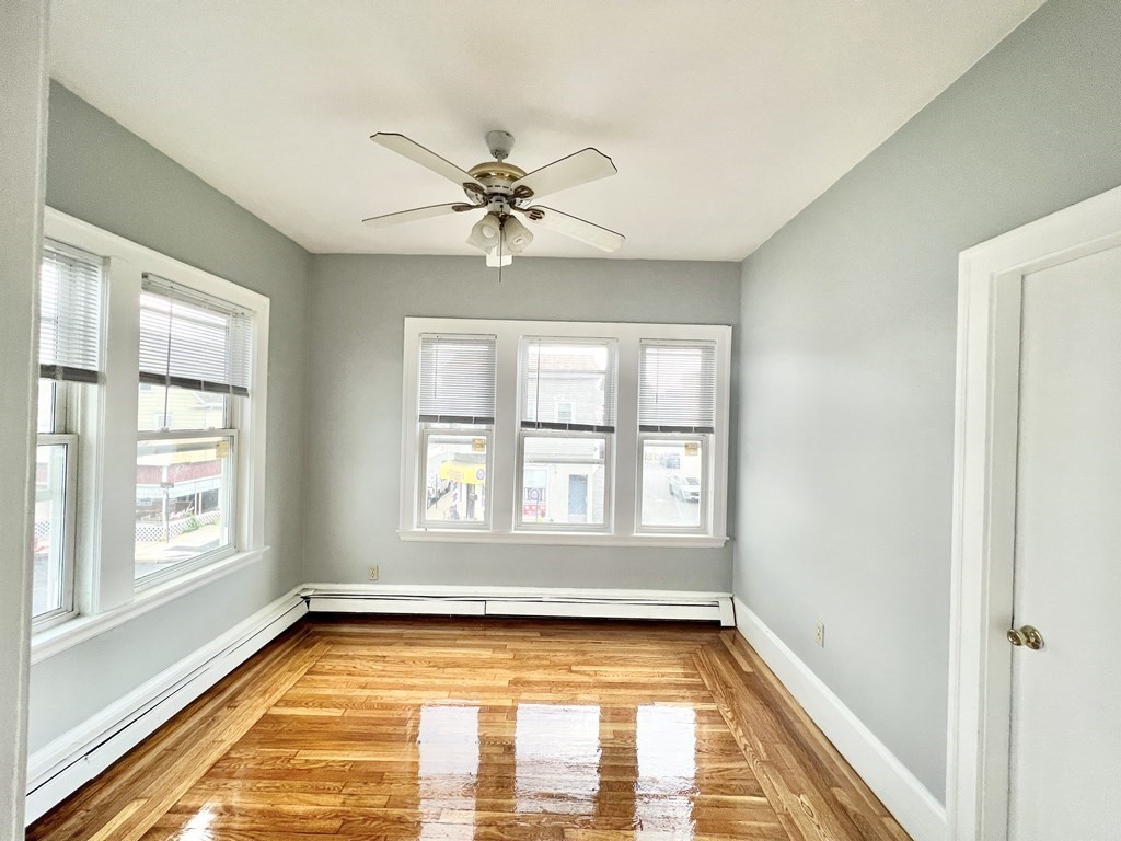 113 Ferry Street, Unit 2 Everett, MA 02149 - Photo 5 of 6 a view of a livingroom with a fireplace