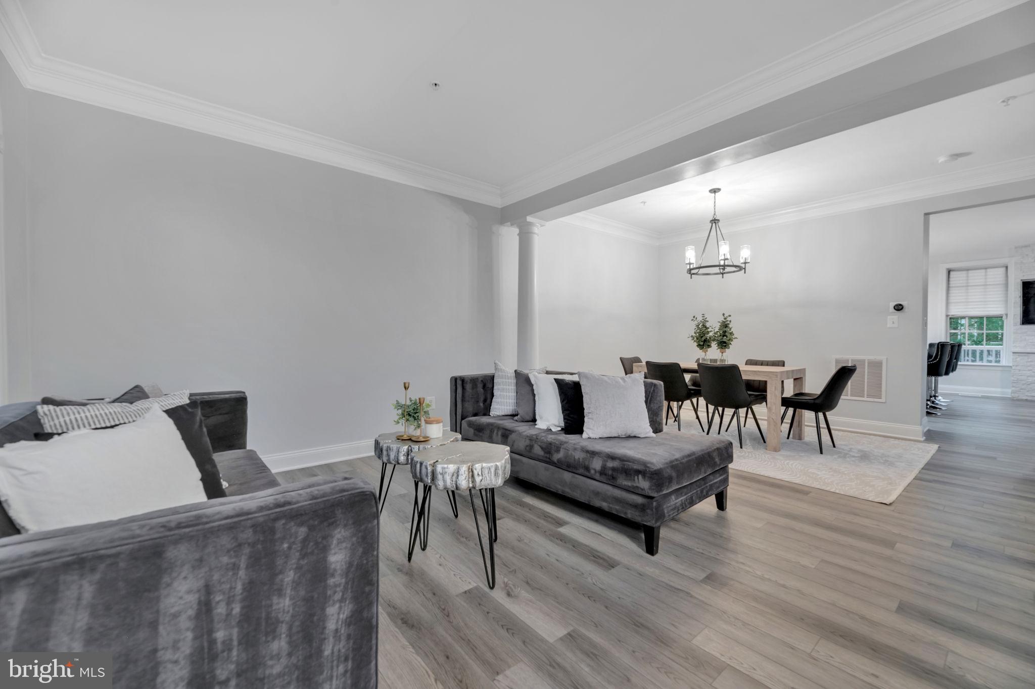 7619 Elmcrest Road Hanover, MD 21076 - Photo 11 of 35 a living room with furniture and wooden floor