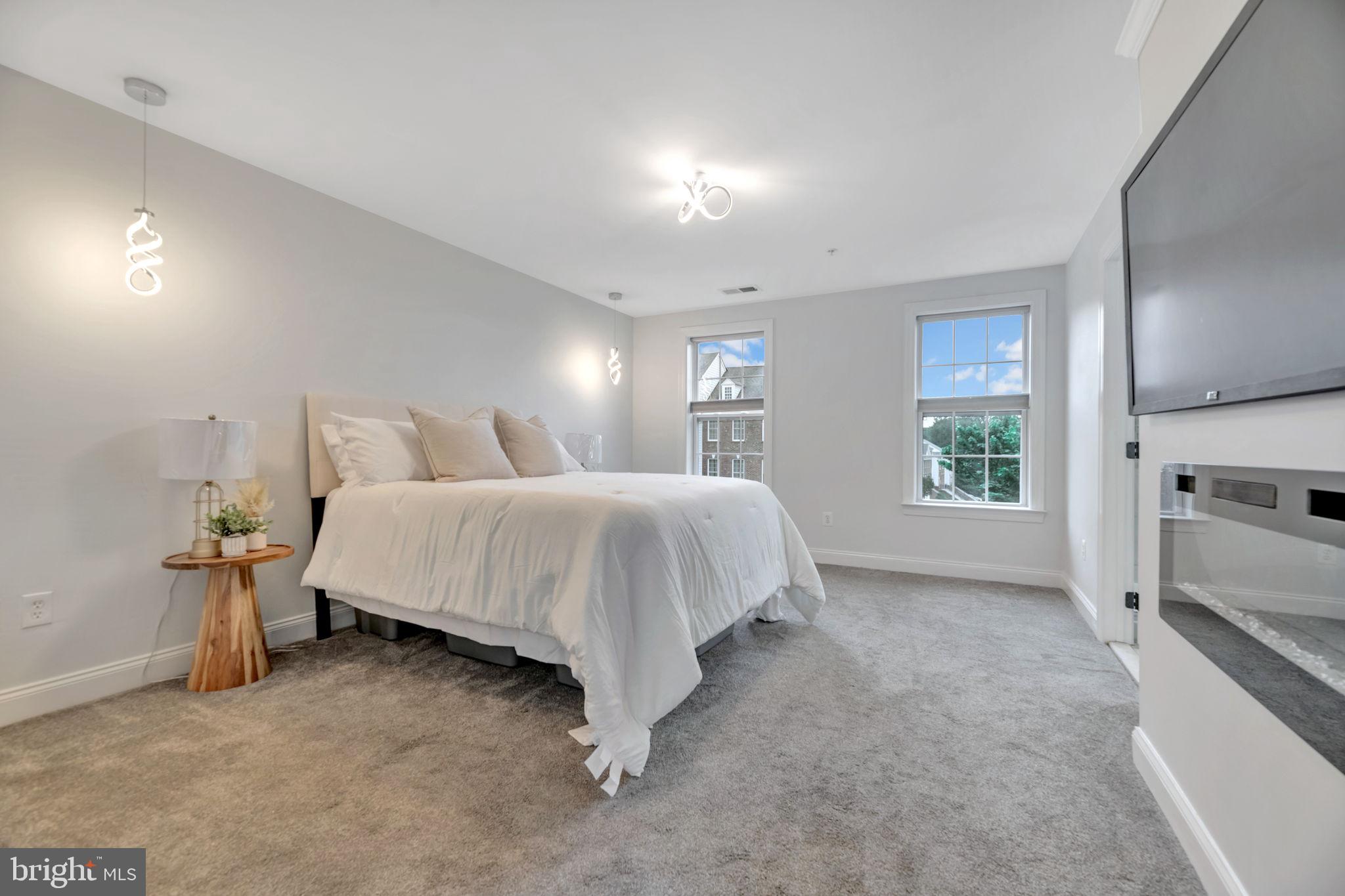 7619 Elmcrest Road Hanover, MD 21076 - Photo 15 of 35 a bed room with a bed and a television