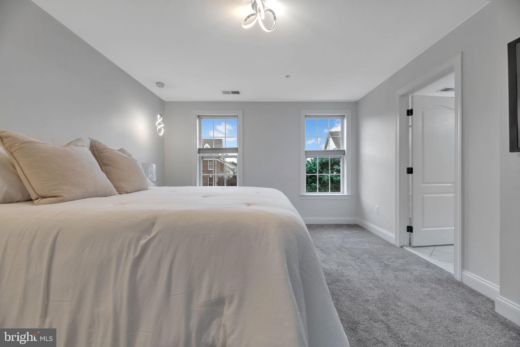 7619 Elmcrest Road Hanover, MD 21076 - Photo 16 of 35 a bedroom with a bed and a window