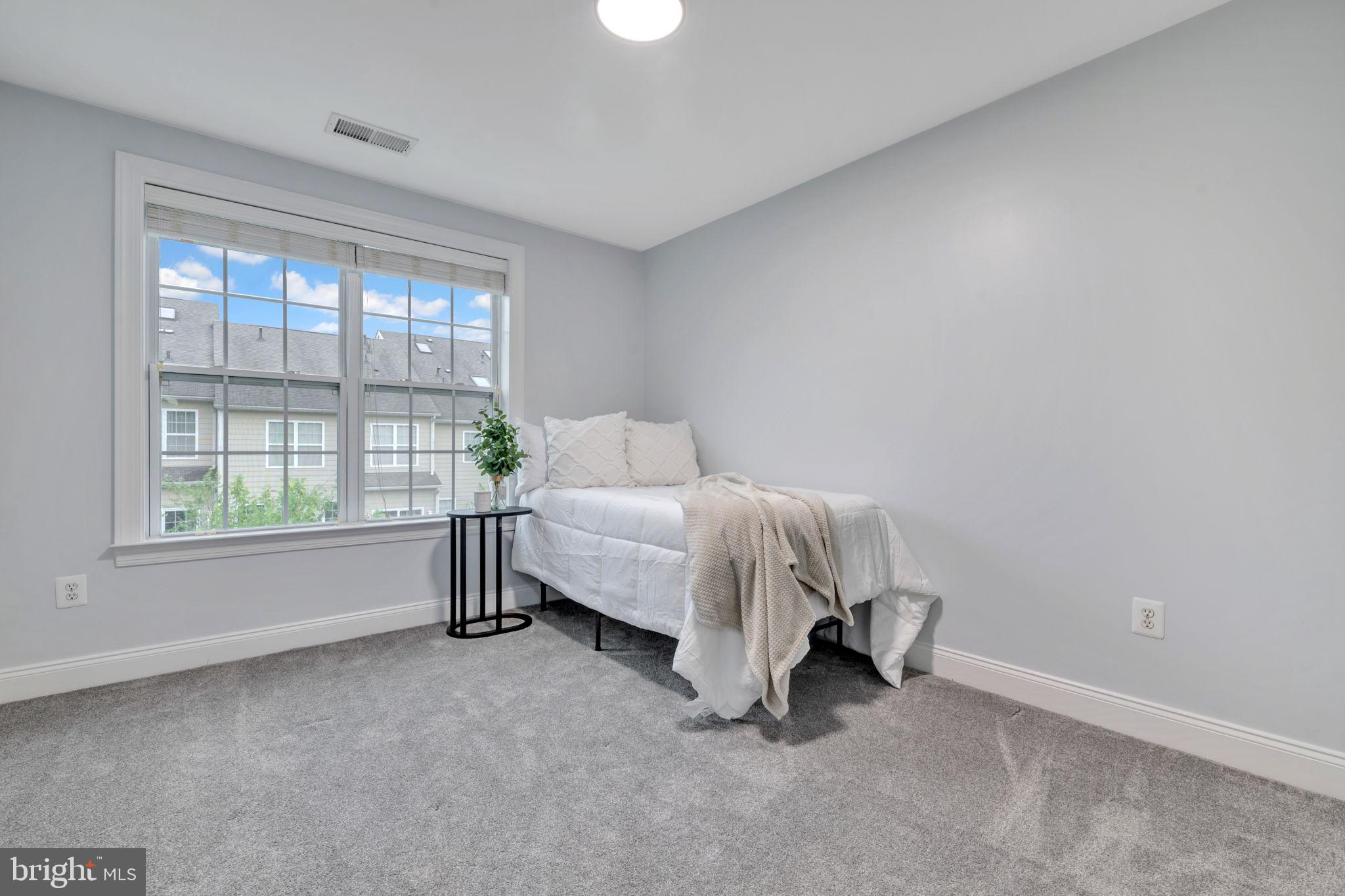 7619 Elmcrest Road Hanover, MD 21076 - Photo 19 of 35 a bed room with a bed and a window