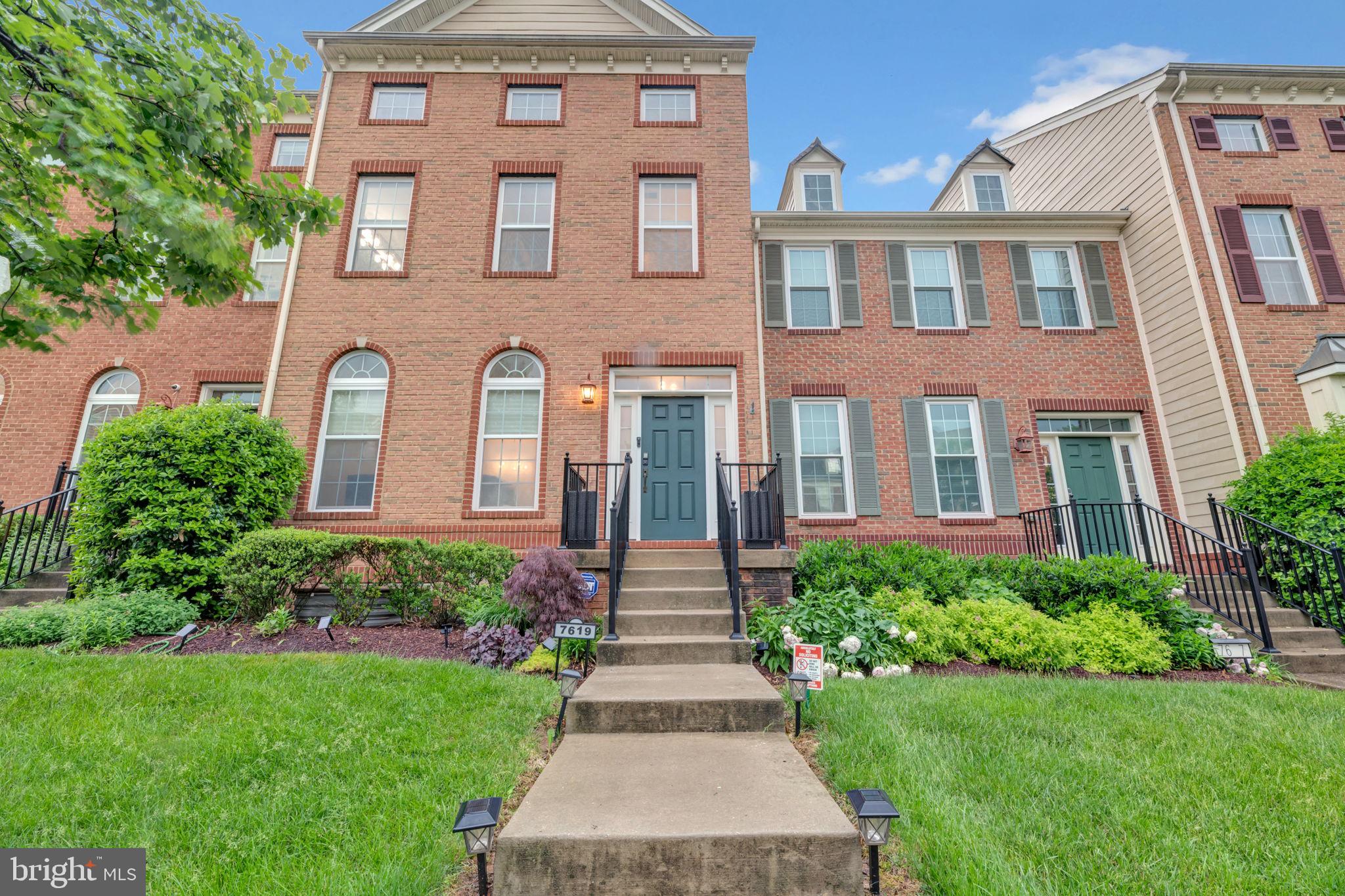 7619 Elmcrest Road Hanover, MD 21076 - Photo 35 of 35 front view of a brick house with a yard