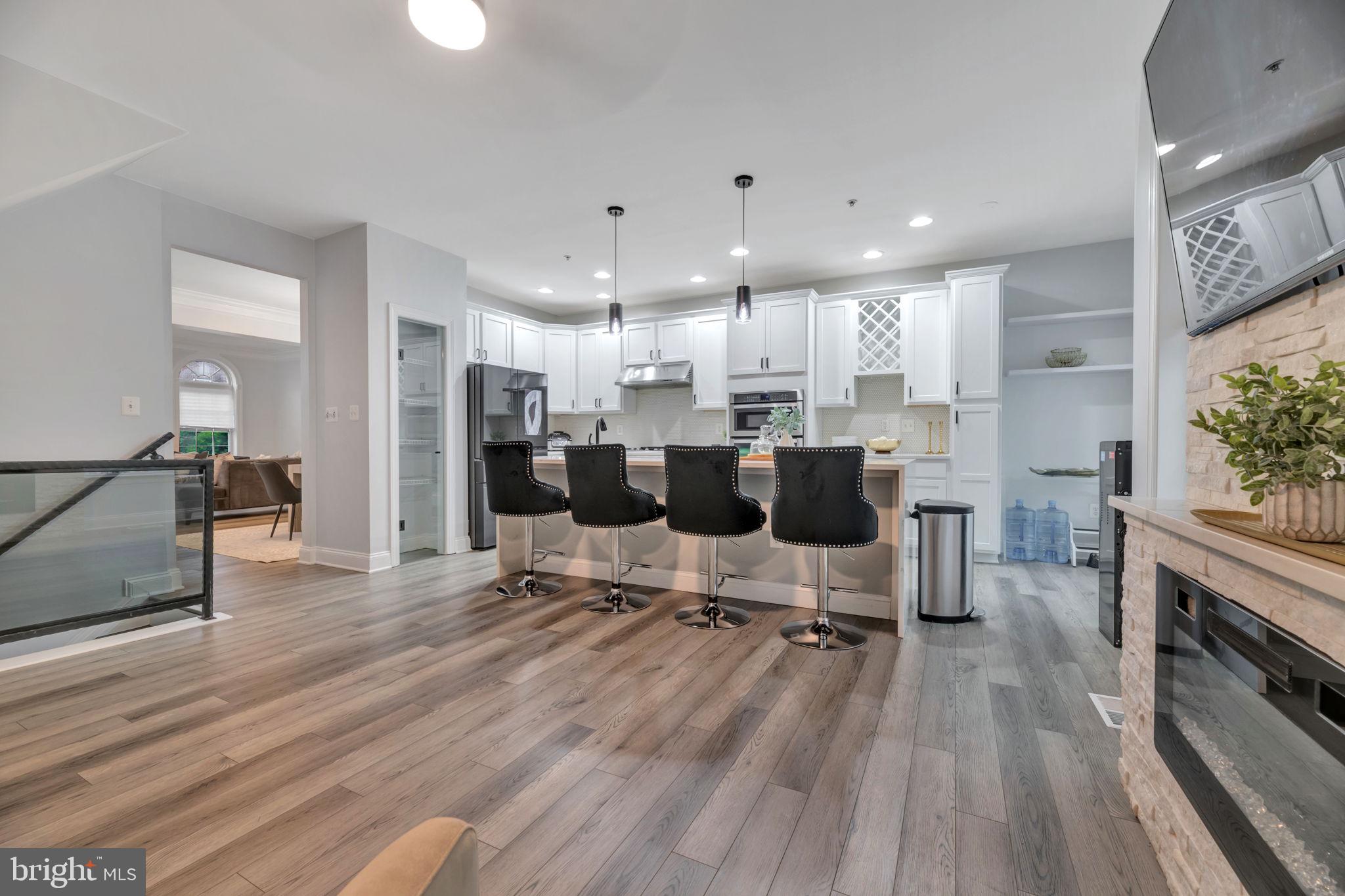 7619 Elmcrest Road Hanover, MD 21076 - Photo 5 of 35 a large kitchen with lots of counter space and stainless steel appliances
