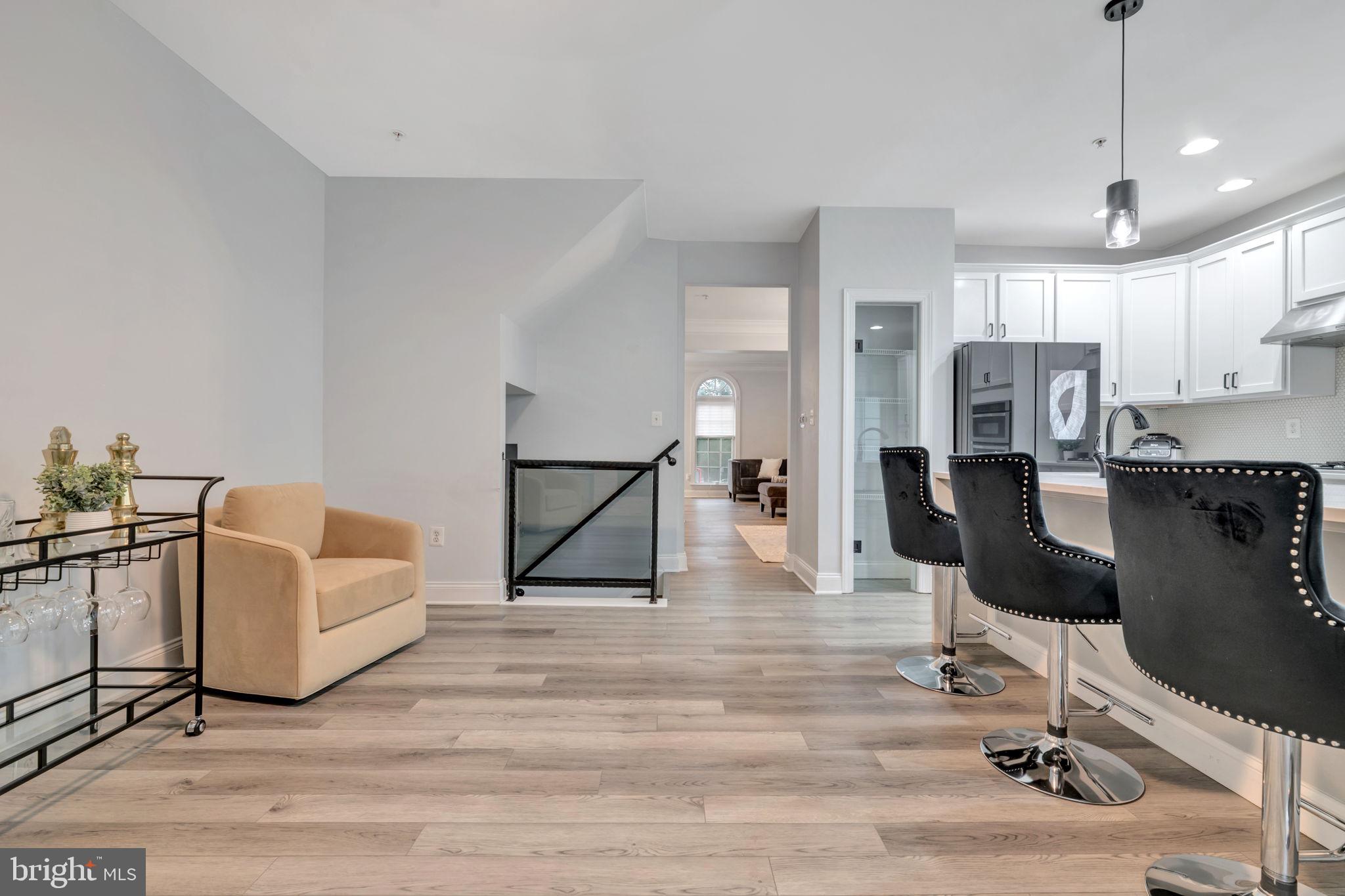 7619 Elmcrest Road Hanover, MD 21076 - Photo 8 of 35 a living room with furniture and a table