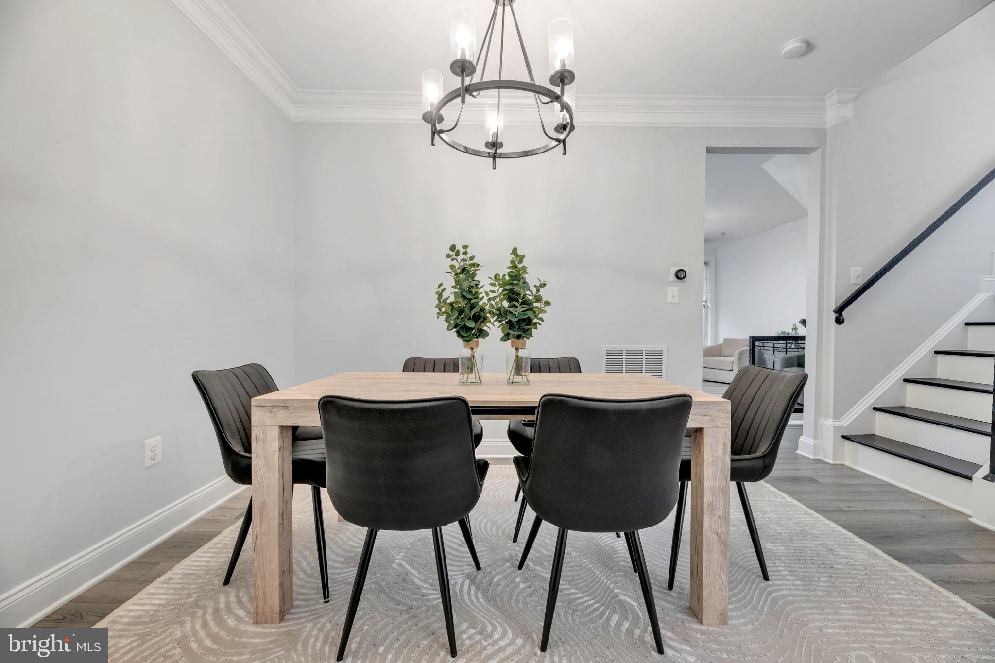 7619 Elmcrest Road Hanover, MD 21076 - Photo 9 of 35 a view of a dining room with furniture and chandelier