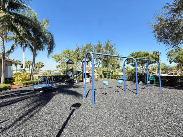 a view of a park with swings and slides