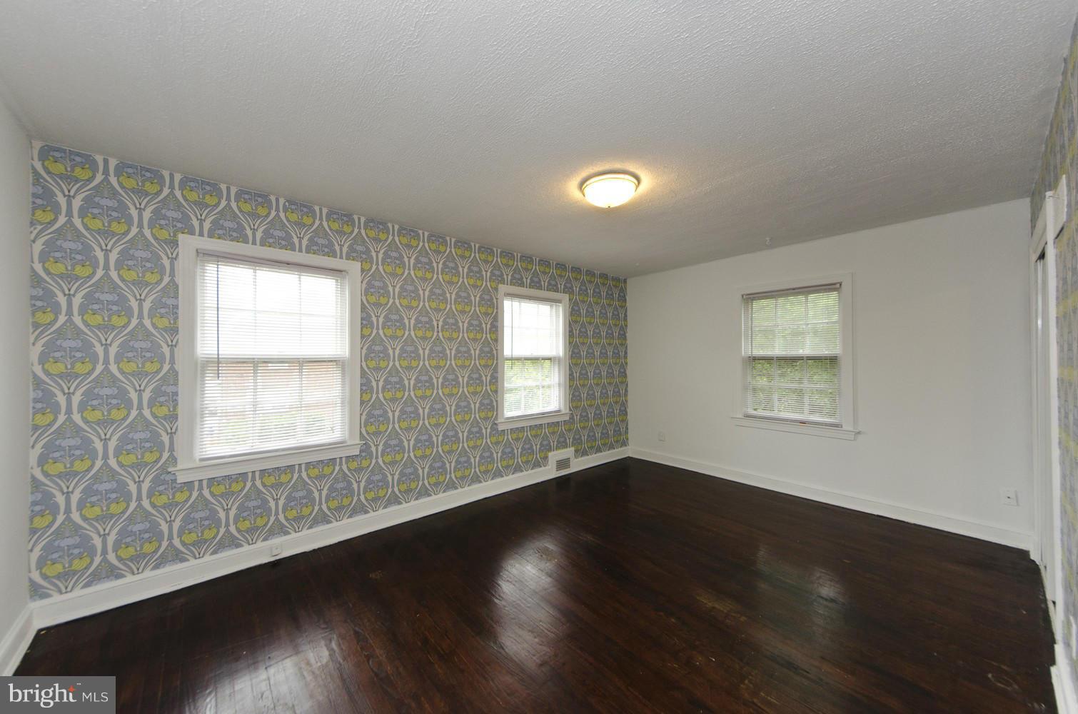 2016 North Troy Street Arlington, VA 22201 - Photo 13 of 25 an empty room with wooden floor and windows