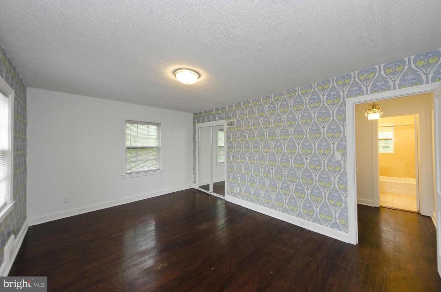 2016 North Troy Street Arlington, VA 22201 - Photo 14 of 25 a view of an empty room with wooden floor and a window