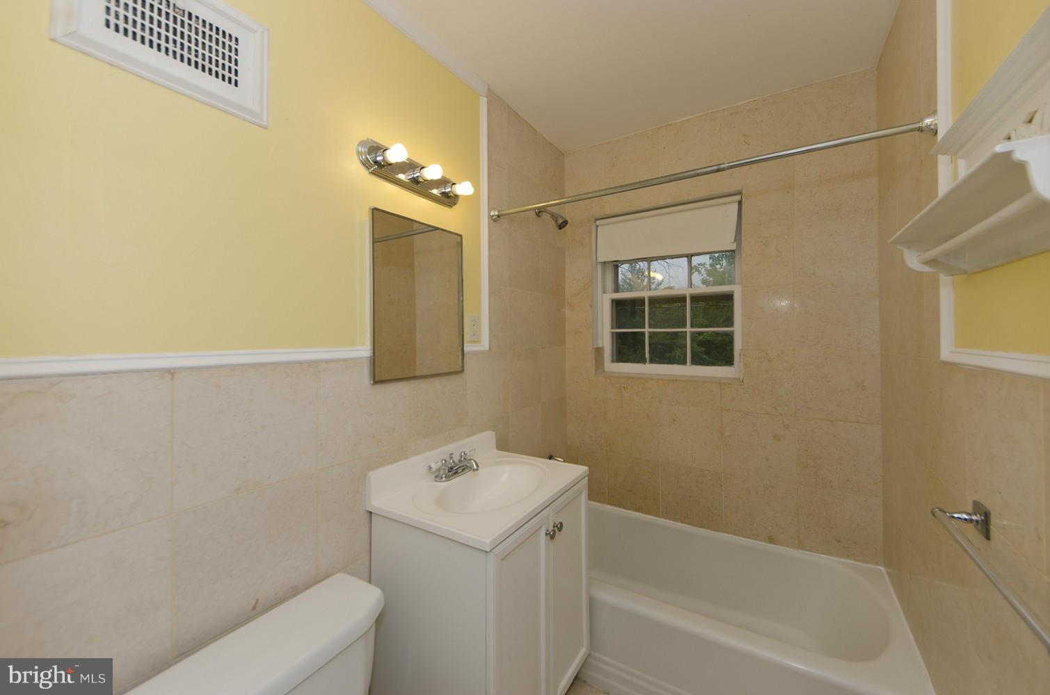 2016 North Troy Street Arlington, VA 22201 - Photo 15 of 25 a bathroom with a sink a toilet and shower