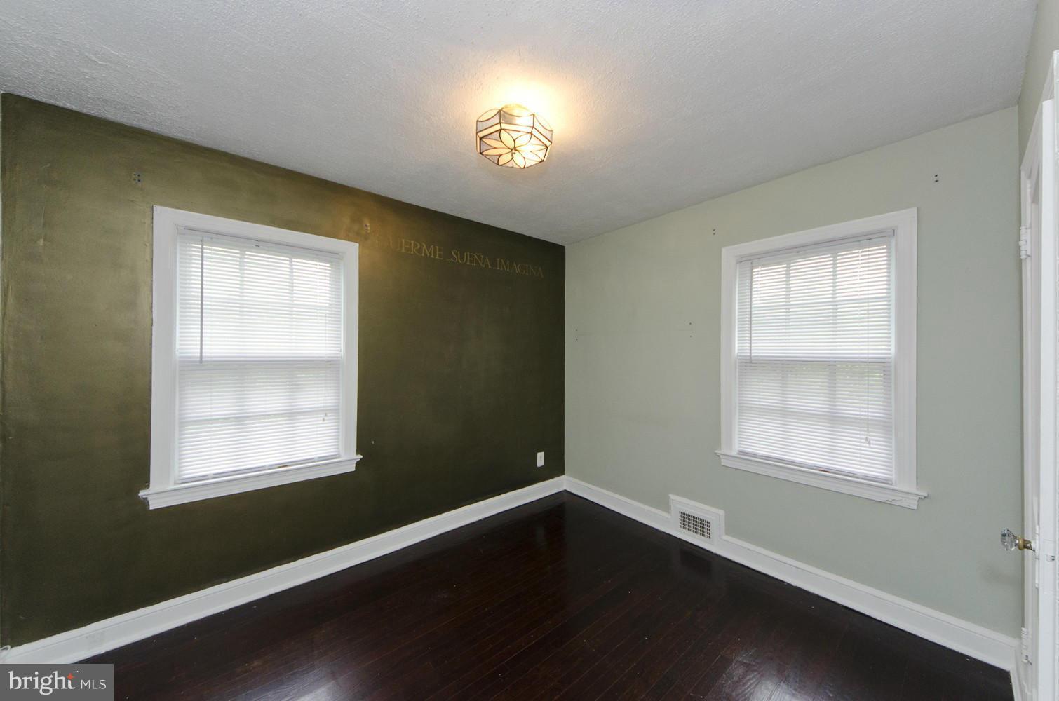 2016 North Troy Street Arlington, VA 22201 - Photo 16 of 25 a view of an empty room with wooden floor and a window