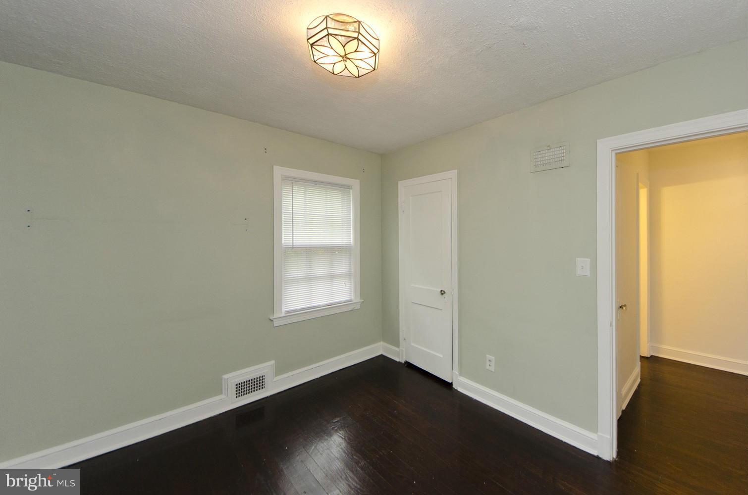 2016 North Troy Street Arlington, VA 22201 - Photo 17 of 25 an empty room with wooden floor and windows