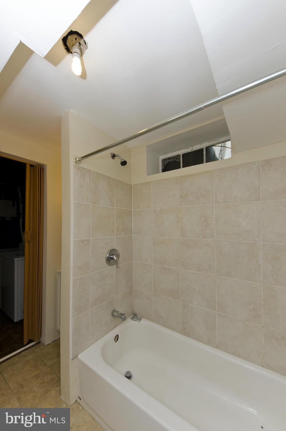 2016 North Troy Street Arlington, VA 22201 - Photo 20 of 25 a bathroom with a bathtub and shower