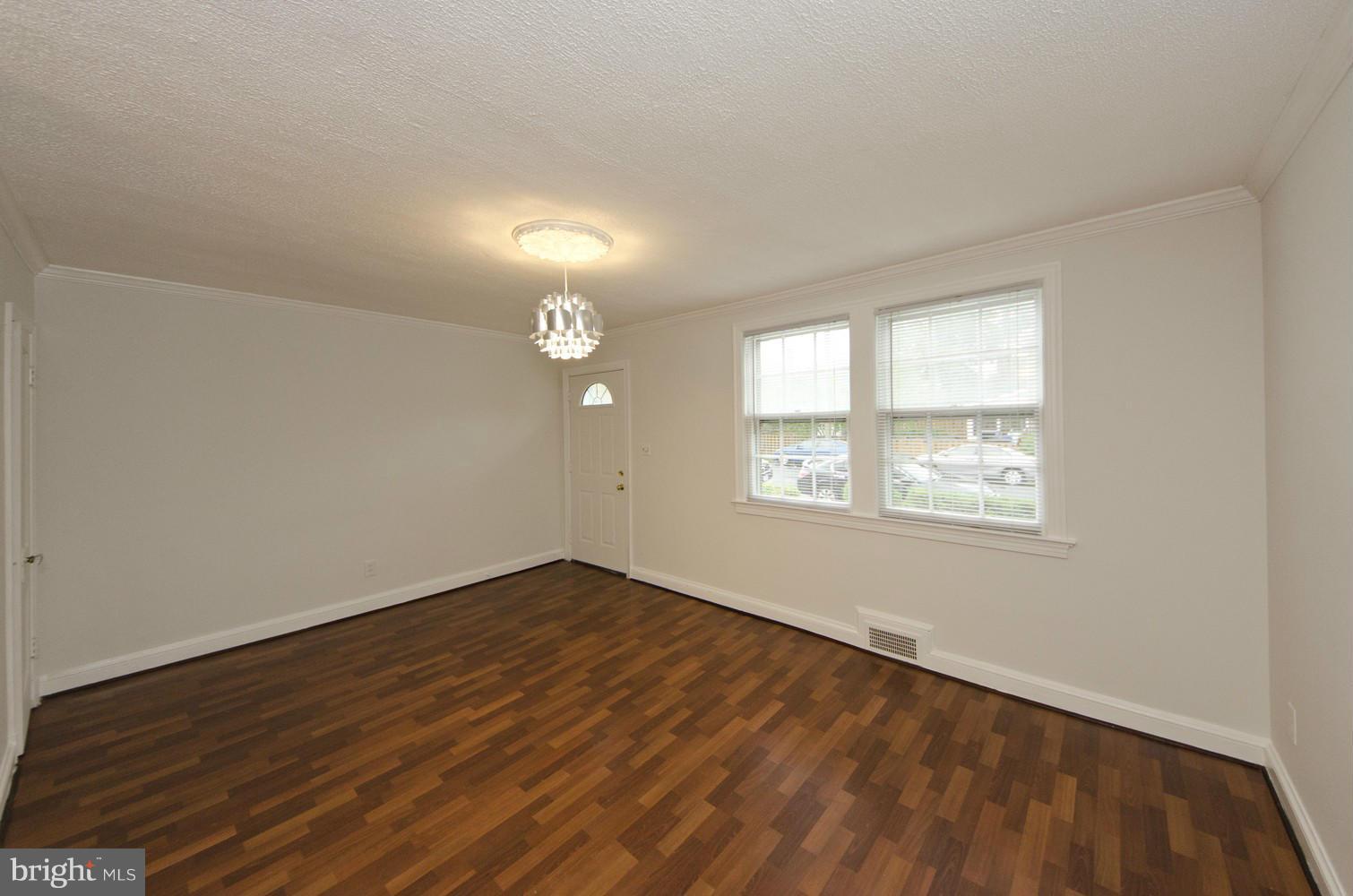 2016 North Troy Street Arlington, VA 22201 - Photo 3 of 25 an empty room with wooden floor and windows