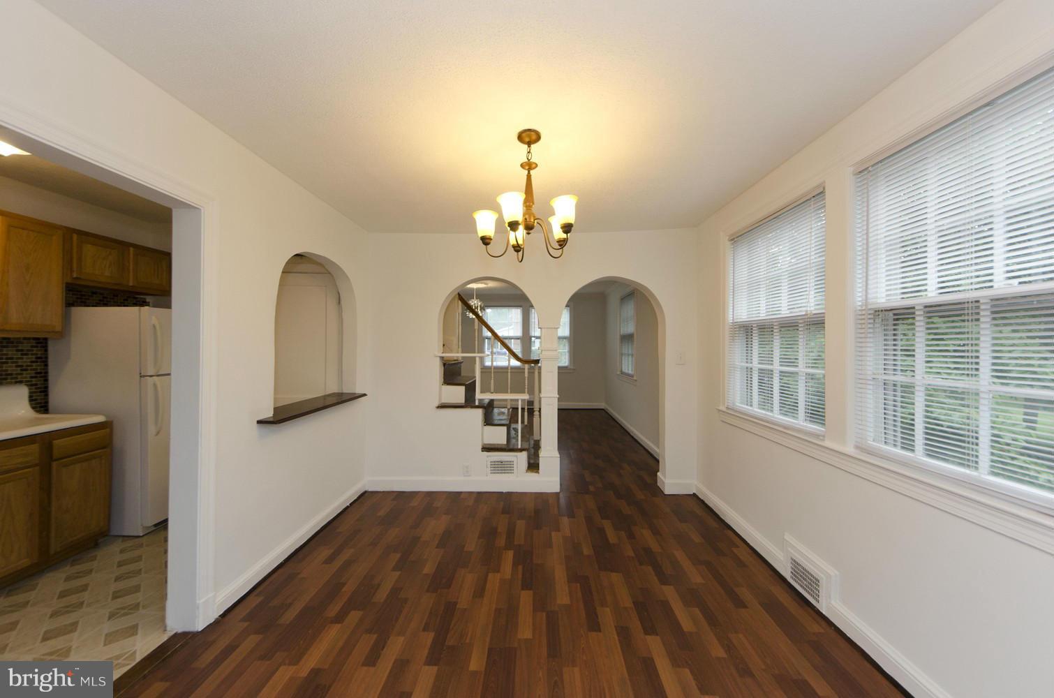 2016 North Troy Street Arlington, VA 22201 - Photo 5 of 25 a view of a room with wooden floor fireplace and windows