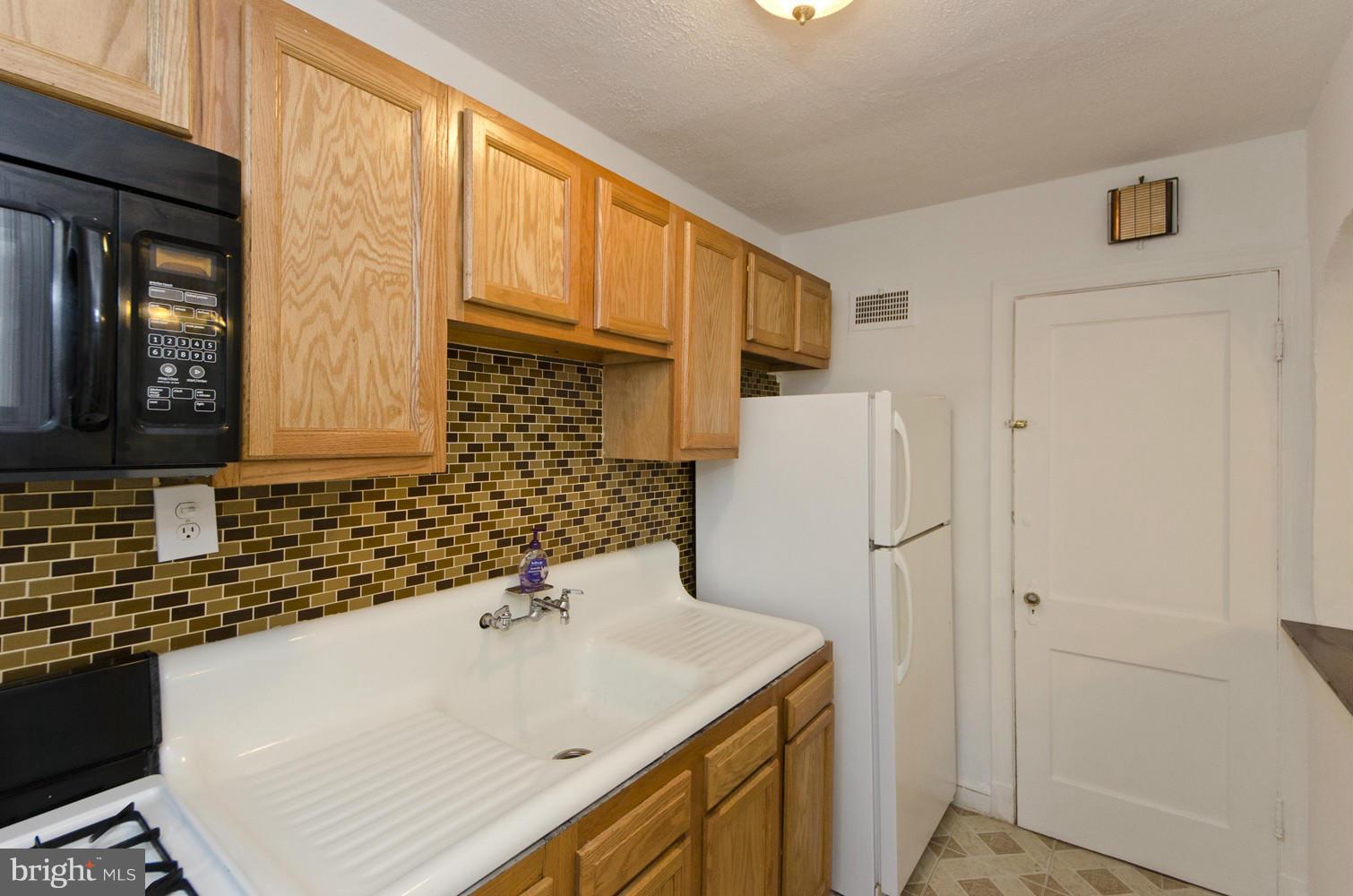2016 North Troy Street Arlington, VA 22201 - Photo 7 of 25 a bathroom with a sink and a mirror
