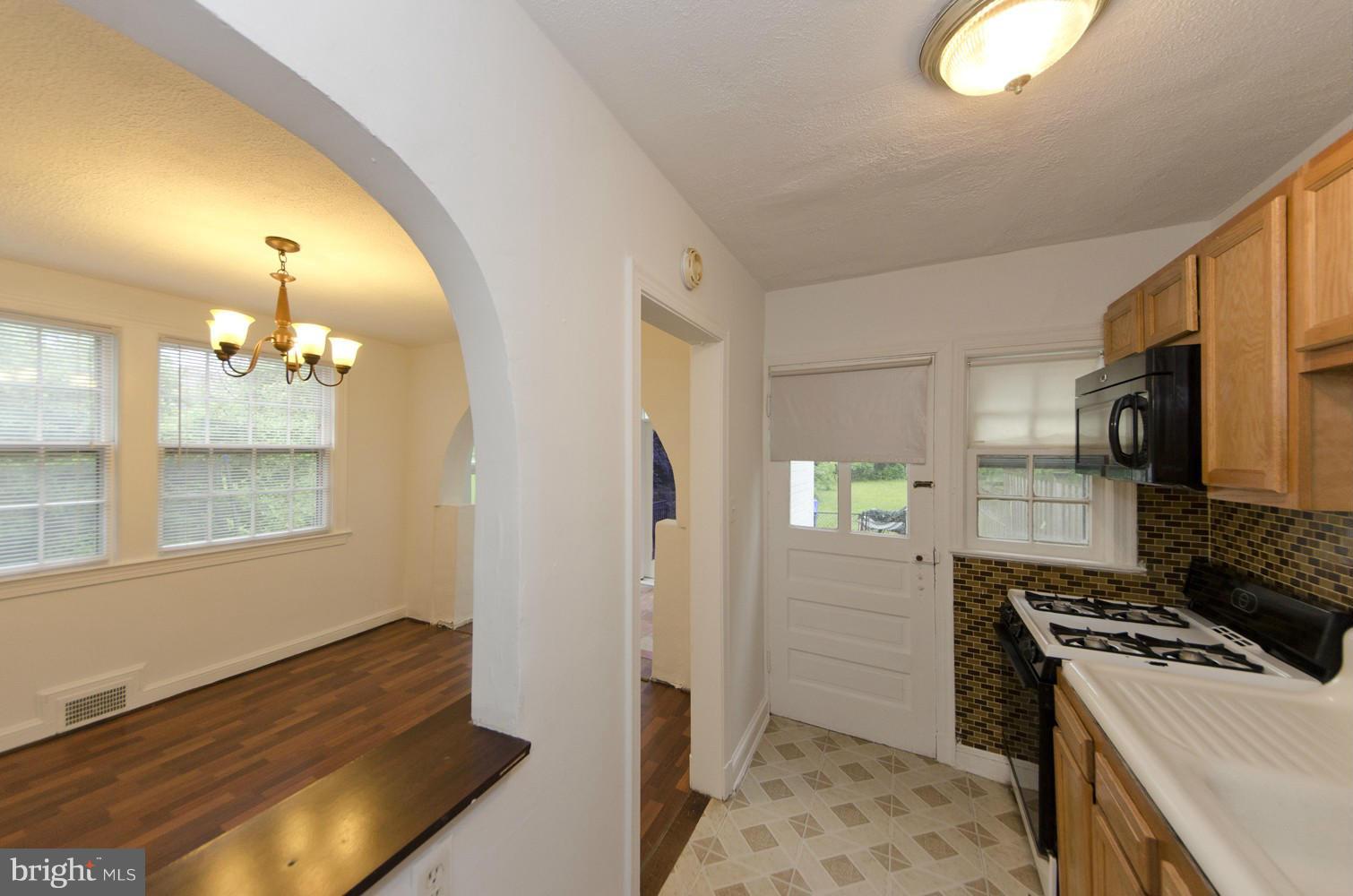2016 North Troy Street Arlington, VA 22201 - Photo 8 of 25 a kitchen that has a sink and a stove in it