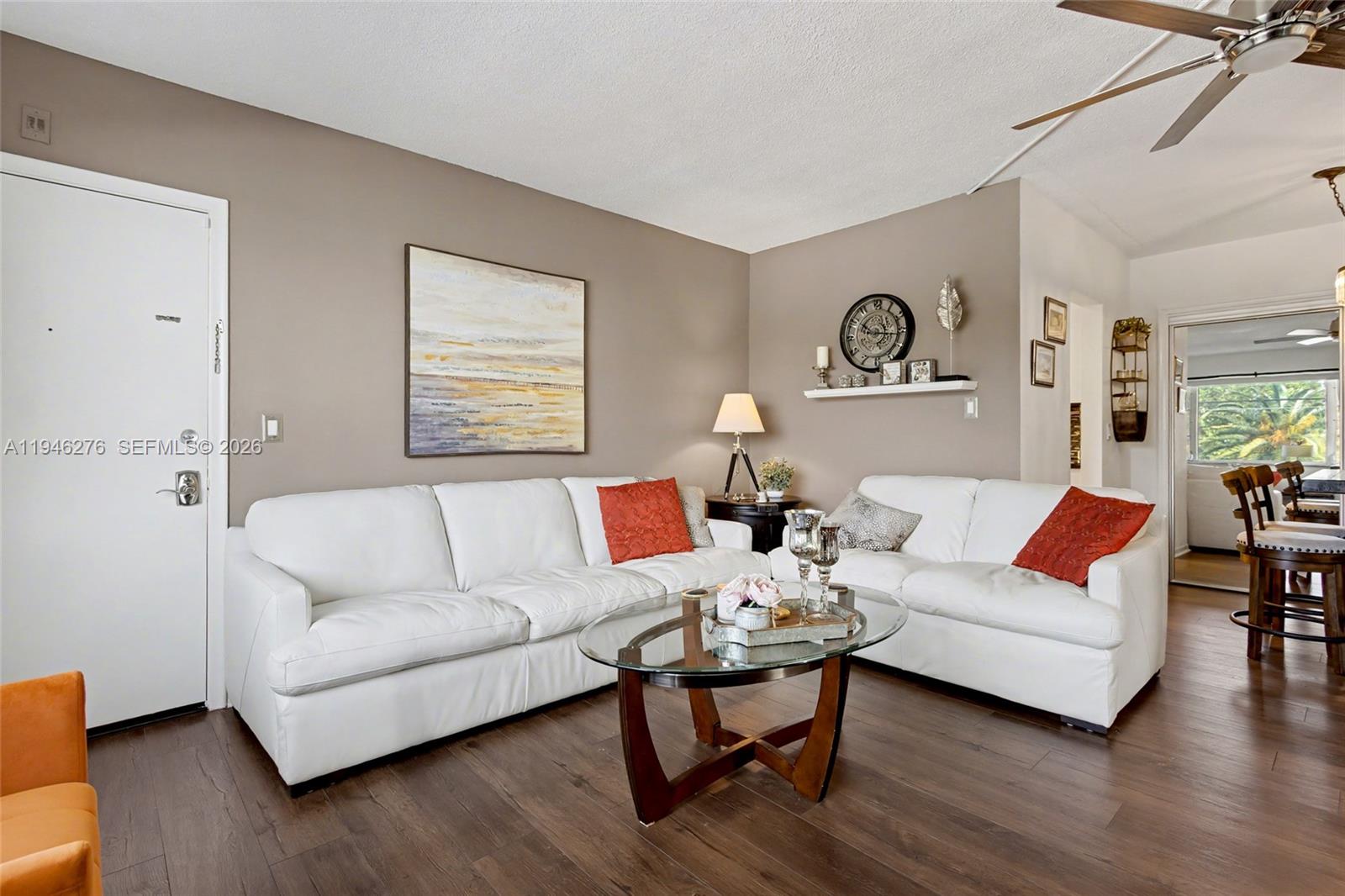 412 South Cypress Road, Unit 222 Pompano Beach, FL 33060 - Photo 17 of 24 a living room with furniture and a wooden floor