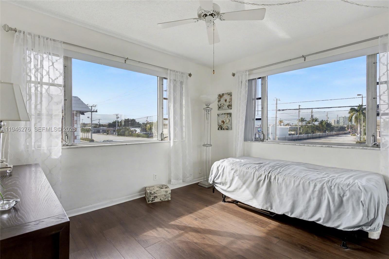 412 South Cypress Road, Unit 222 Pompano Beach, FL 33060 - Photo 18 of 24 a bedroom with a bed and window