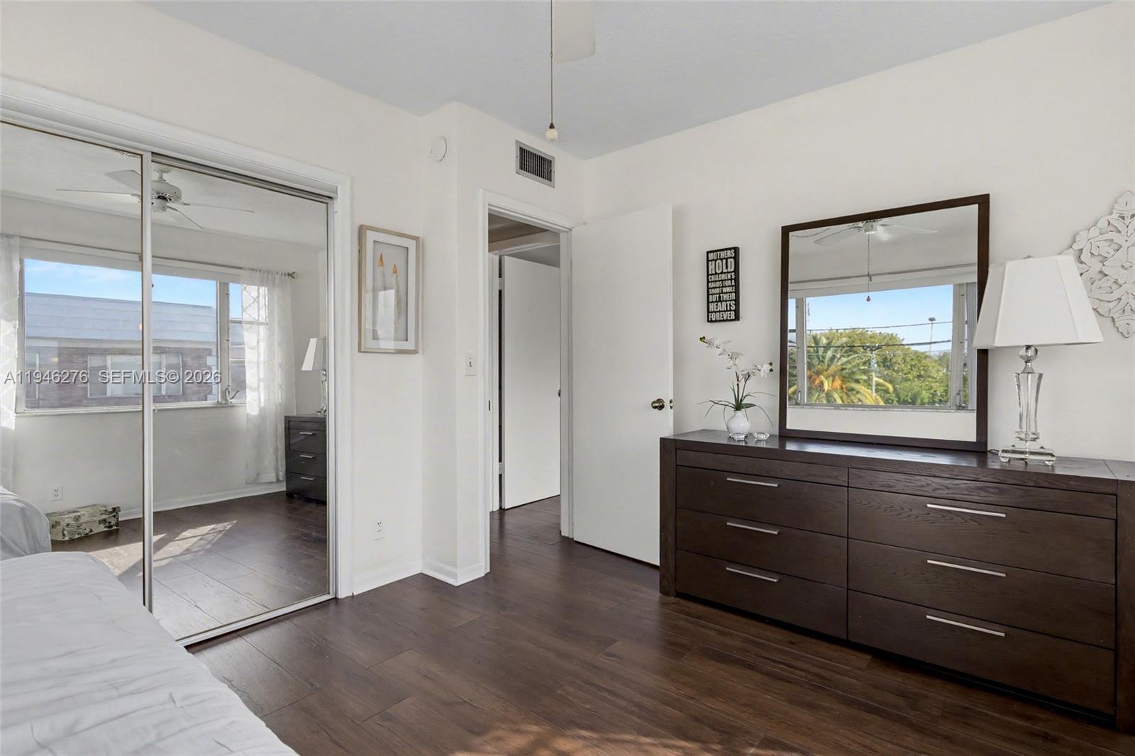 412 South Cypress Road, Unit 222 Pompano Beach, FL 33060 - Photo 19 of 24 a room with a dresser and a window