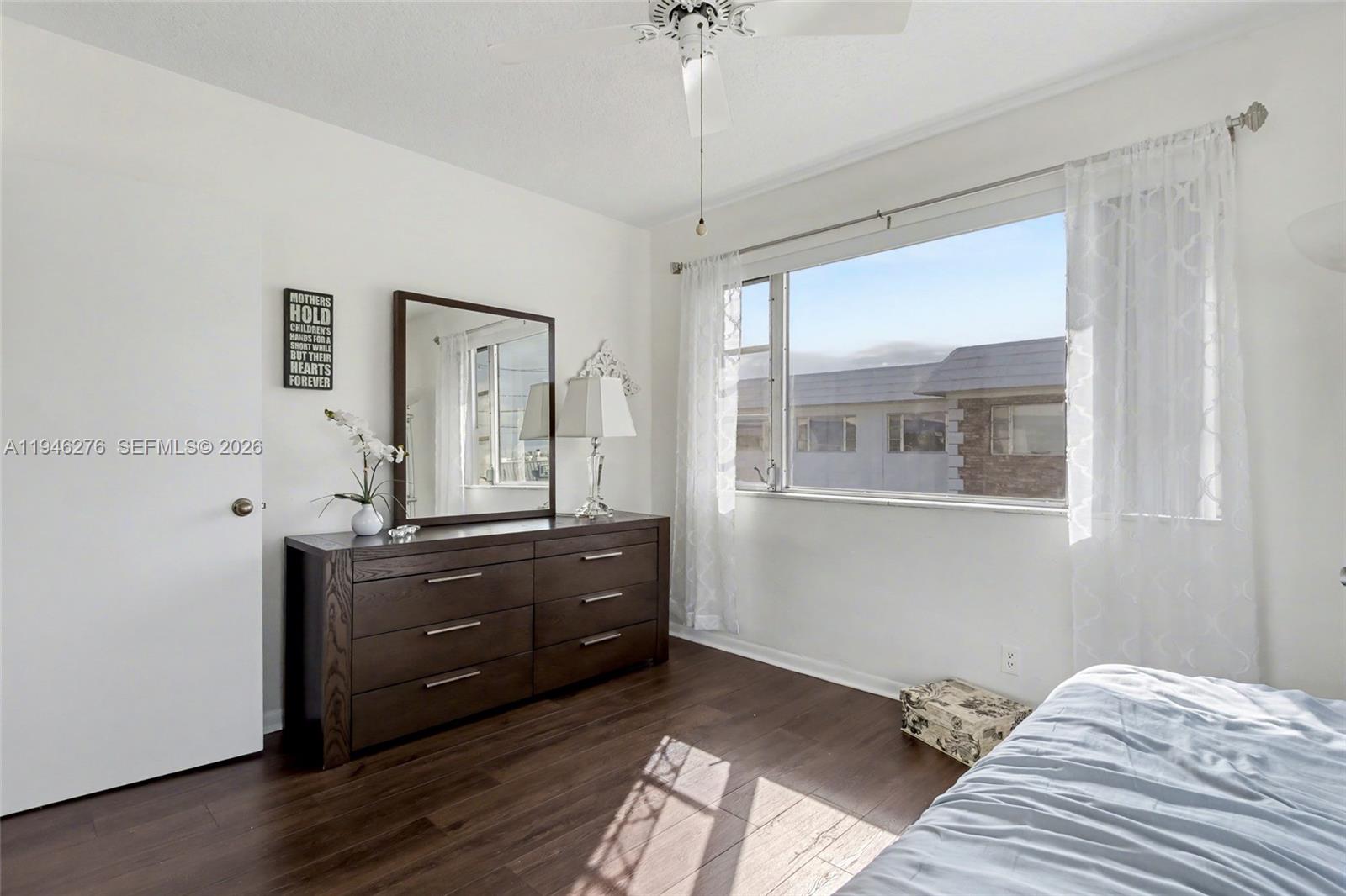 412 South Cypress Road, Unit 222 Pompano Beach, FL 33060 - Photo 20 of 24 a bed room with a bed and a window