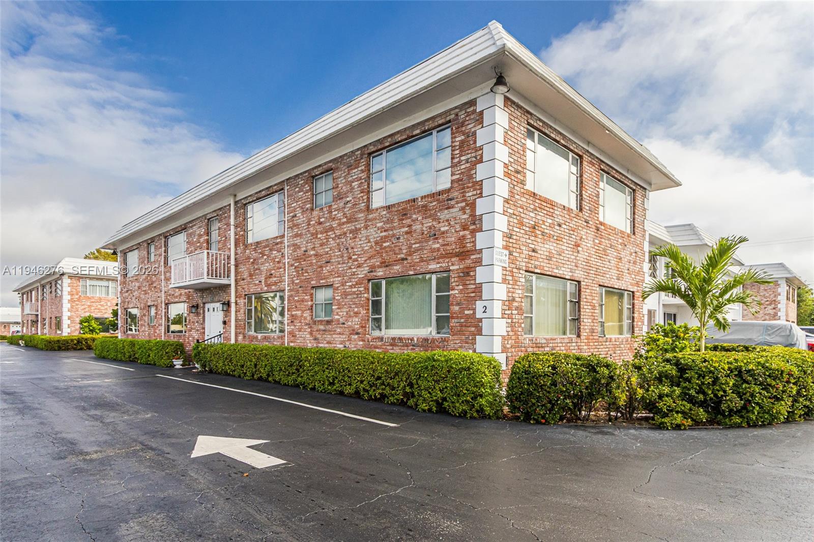 412 South Cypress Road, Unit 222 Pompano Beach, FL 33060 - Photo 22 of 24 a front view of a building