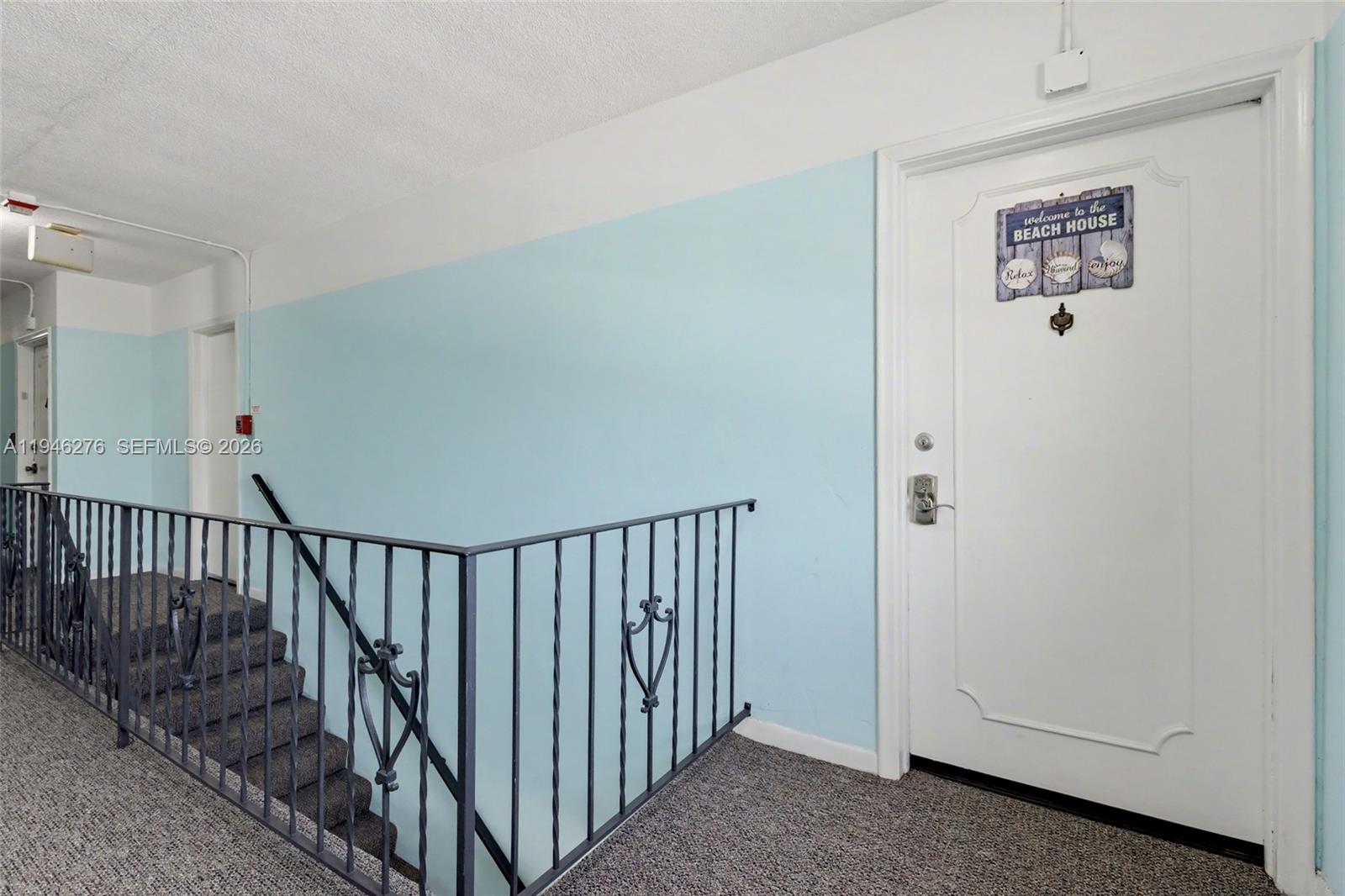 412 South Cypress Road, Unit 222 Pompano Beach, FL 33060 - Photo 24 of 24 a view of hallway with stairs