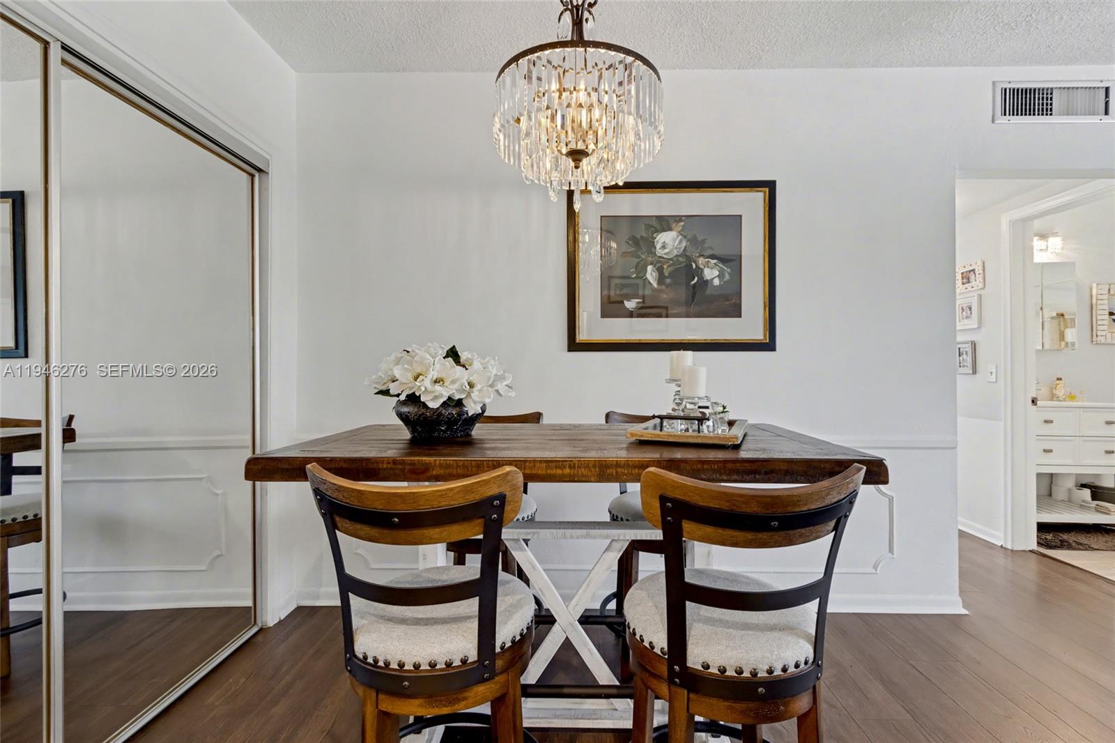 412 South Cypress Road, Unit 222 Pompano Beach, FL 33060 - Photo 5 of 24 a dining room with furniture and wooden floor