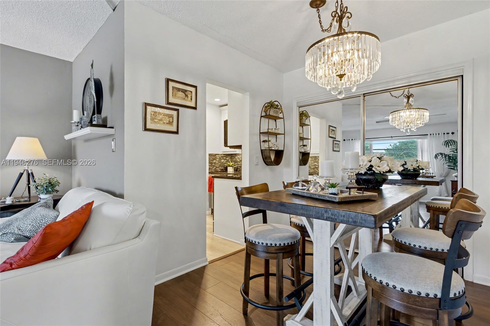 412 South Cypress Road, Unit 222 Pompano Beach, FL 33060 - Photo 7 of 24 a view of a livingroom with furniture and a chandelier