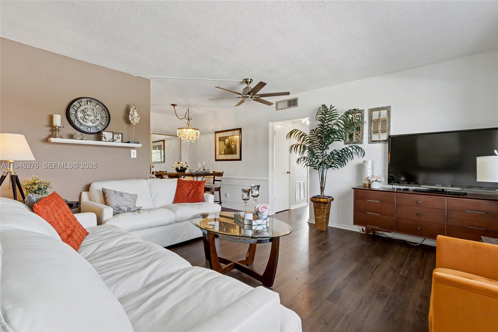 412 South Cypress Road, Unit 222 Pompano Beach, FL 33060 - Photo 8 of 24 a living room with furniture and a flat screen tv