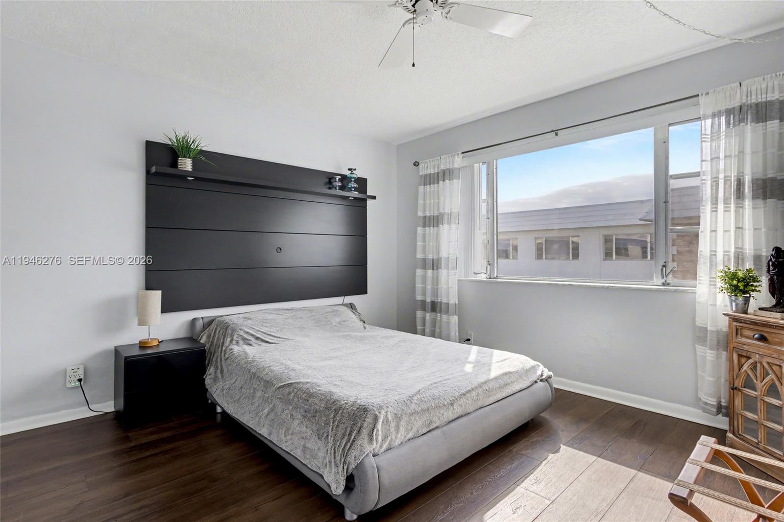 412 South Cypress Road, Unit 222 Pompano Beach, FL 33060 - Photo 9 of 24 a bedroom with a bed and a window