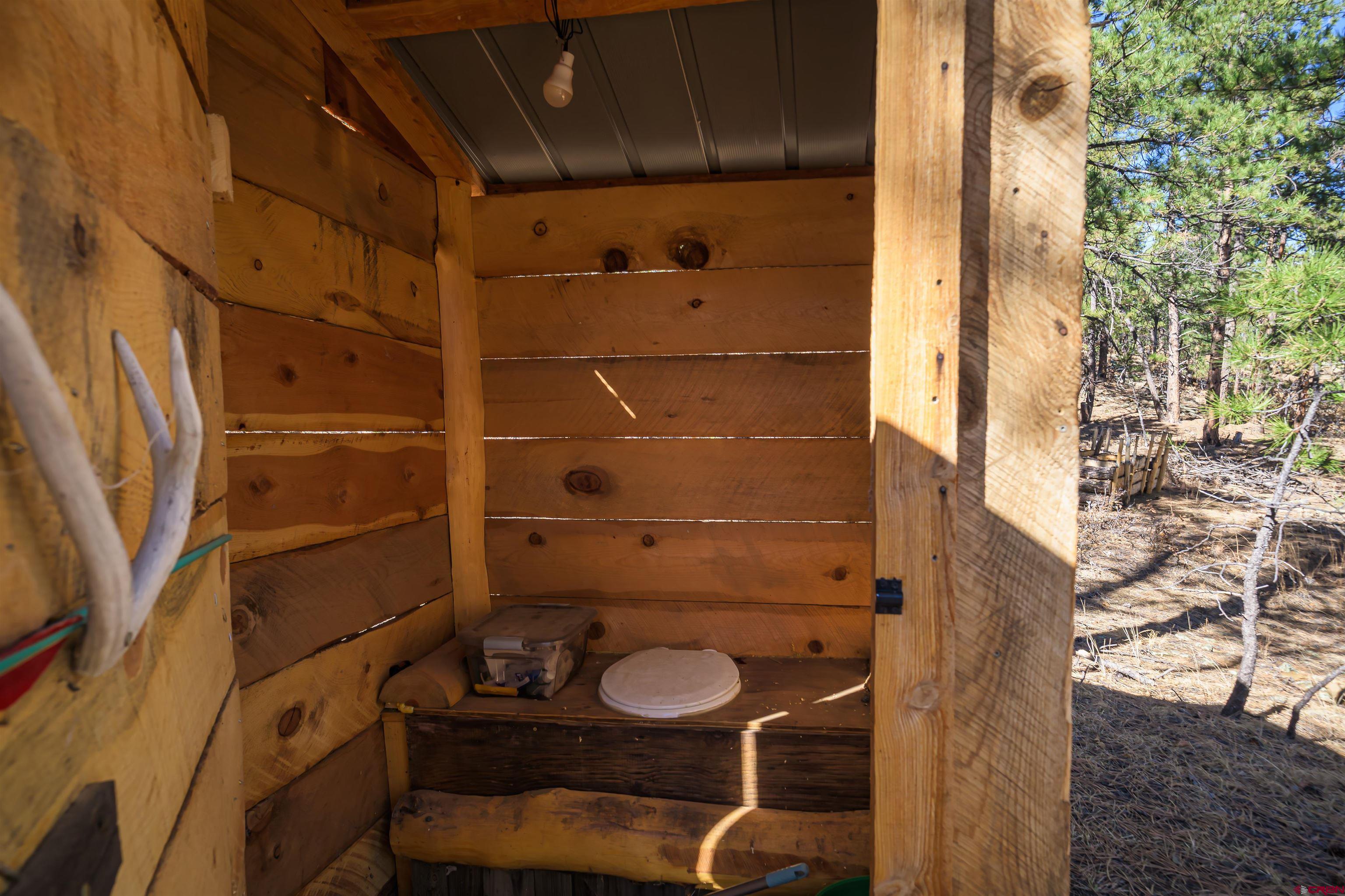 17990 Kings Road Weston, CO 81091 - Photo 39 of 45 a bathroom with a sink toilet and shower