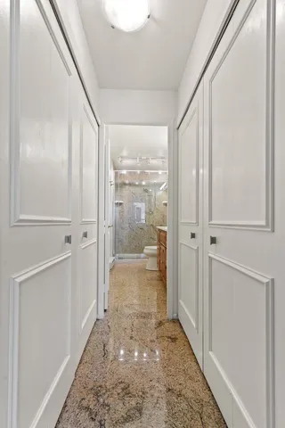 a bathroom with a glass door shower